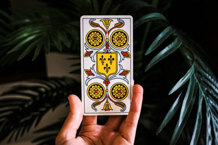 person-holding-jack-of-spade-playing-card