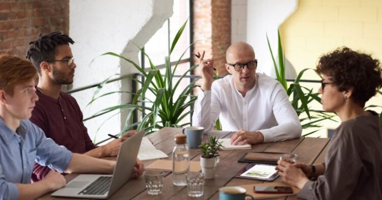 Business Meeting - Man Wearing White Long-sleeved Shirt Holding Black Pen