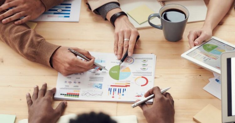 Business Meeting - People Discuss About Graphs and Rates