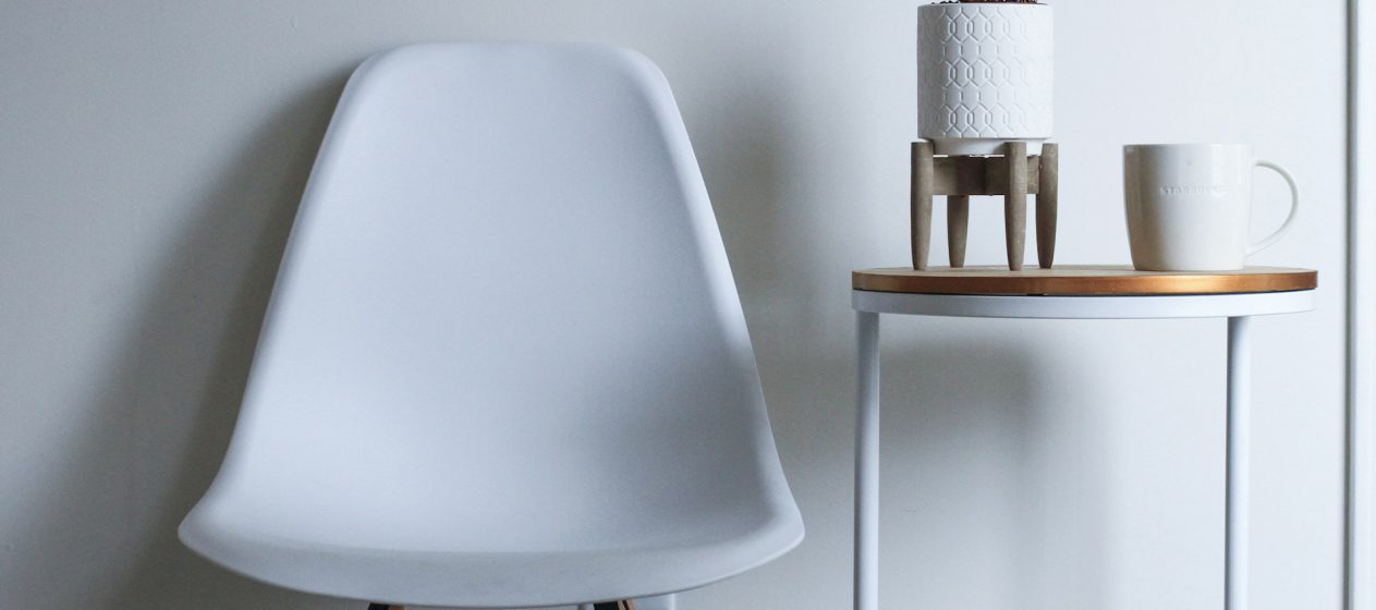 round-white-and-brown-wooden-table-near-chair